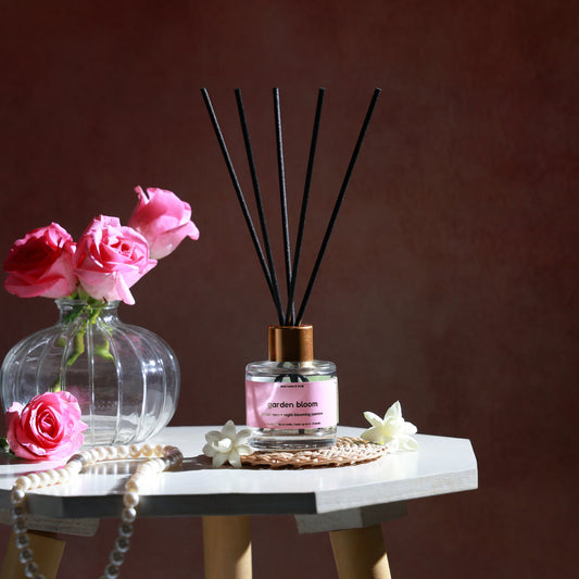 Should I use a reed diffuser or scented candle for my living room?